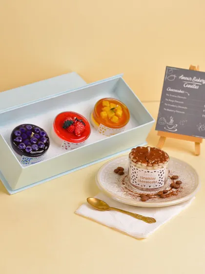 A sweet display of my Cheesecake Collection. This image showcases the Tiramisu, Mango, Strawberry, and Blueberry cheesecake candles, perfect for dessert lovers.