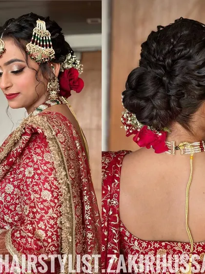 This intricate updo combines twists and a low bun, adorned with fresh red roses and baby's breath. The addition of a traditional passa headpiece completes this classic bridal look, perfect for a Muslim wedding ceremony.