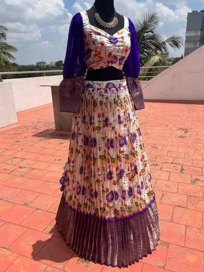 The full view of the purple-sleeved floral lehenga.