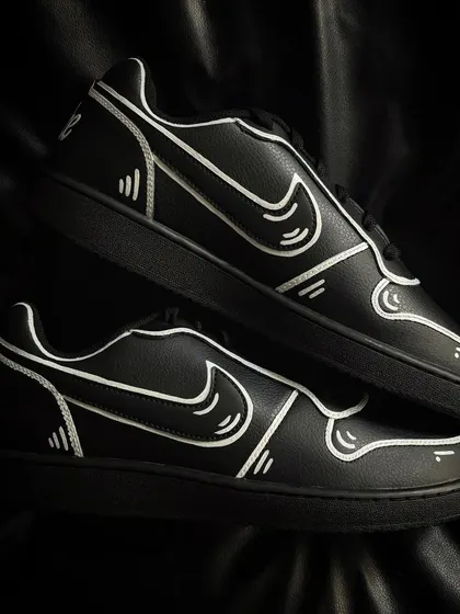 A top-down view of the cartoon-style Nike Ebernons.