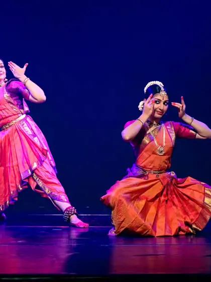 An energetic moment from a duet performance. My choreography often includes intricate footwork and rhythmic patterns that challenge the dancers and energize the audience.