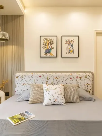 Another angle of the bedroom, focusing on the custom bed and the stylish wardrobe with integrated open shelving.
