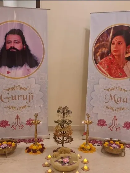 A decorative setup for our Chakra Meditation Program, with banners of Guruji and Maa. This image highlights the reverence and sacredness with which we conduct our spiritual events.