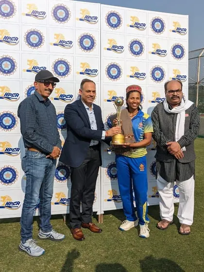 A player from our U-19 women's team receives the championship trophy, a testament to her hard work and our academy's training.