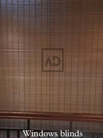 A full view of a bamboo roller blind covering a window. This style is perfect for adding a touch of nature indoors and works well in both homes and relaxed commercial settings like cafes or boutiques.