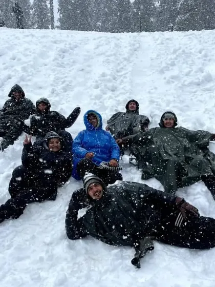 Another fun shot of our group lying in the snow, making memories together. We ensure our treks are filled with laughter and camaraderie.