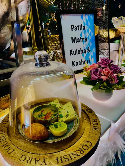 An elegant presentation of Patila Matra Kulcha and Kachori at a live station. I take pride in elevating traditional Indian street food with refined plating and high-quality ingredients for a sophisticated culinary experience.
