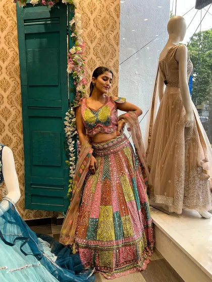 A full-length view of Chandna Gowda in our multi-color lehenga, showcasing its beautiful flare and unique design.