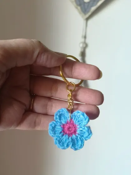 A two-toned blue and pink floral keychain. We can customize the colors to your liking.