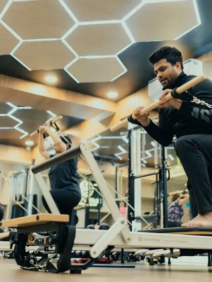 This client performs a deep stretch using the Reformer, working on flexibility and control. Regular stretching is key to keeping the body limber and injury-free.