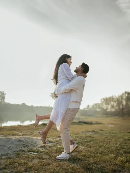 A classic, romantic lift by the lake. This shot is a testament to our ability to capture timeless, joyful pre-wedding moments.