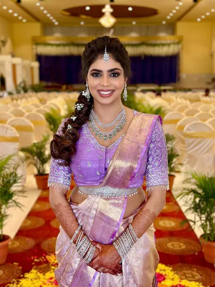 A full-length portrait of Charu at her engagement, looking radiant and happy.