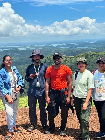 A group of trekkers at the summit of Kodachadri, enjoying the panoramic views of the Sharavathi valley.