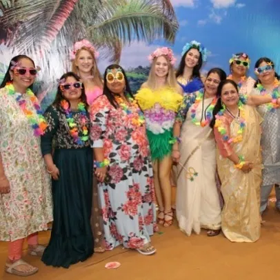 Guests dressed up and enjoying a Hawaiian-themed party. I can even help coordinate with entertainers who fit the theme to complete the experience.