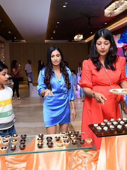 Guests enjoying the dessert spread at a birthday party. I make sure to offer a variety of mini desserts so there is something for everyone to try.