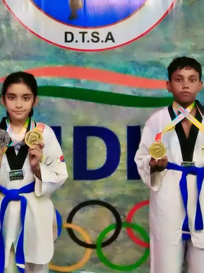 Naysha and Rohan showing off their collection of medals. Both are champions from my academy.