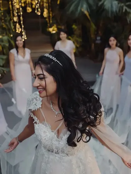 The bride and her tribe. This joyful photo with her bridesmaids captures the fun, friendship, and excitement of the wedding day, a memory to be cherished forever.