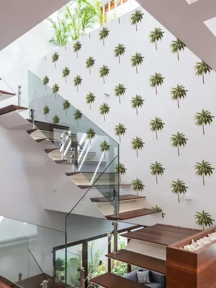 This staircase is transformed into a tropical ascent with our Bohemian Palm Tree wall stickers. The pattern adds a fun and stylish element to the home’s design.