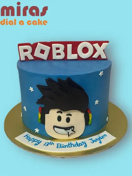 A cool Roblox cake for a 13th birthday. This blue cake features a player avatar head and the iconic game logo, making it a great choice for any Roblox enthusiast.