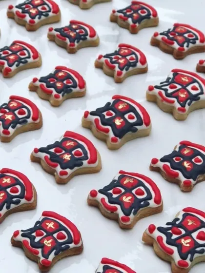 And here are the red house cookies, finished with a touch of edible gold. It was so special to be a part of this celebration for my school in such a unique way.