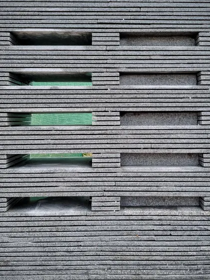 The finished mock-up of the granite screen shows the pattern of voids and solids. This hands-on testing is a core part of our design process for creating unique architectural and furniture elements.