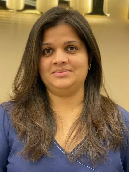A frontal view of a client's new haircut, showing how the layers frame her face and create a flattering shape.