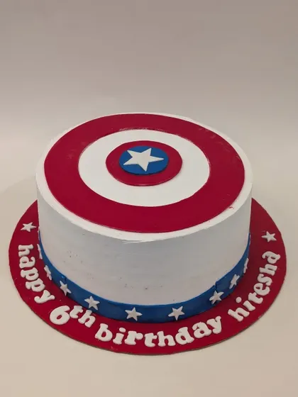 A classic Captain America shield cake. The simple, bold design is perfect for a superhero themed party and is personalized with a birthday message around the base.