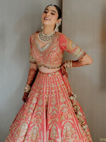 The pure, uninhibited joy of a bride on her wedding day. This candid shot perfectly captures her happiness and excitement.