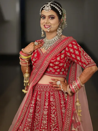 This stunning bride in her red lehenga is a perfect example of a classic North Indian bridal look. We focused on radiant skin, bold eyes, and a traditional bridal bun adorned with flowers.