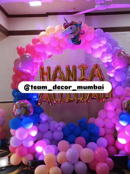 The beautiful blend of colors in the unicorn balloon arch, perfect for a magical first birthday party.