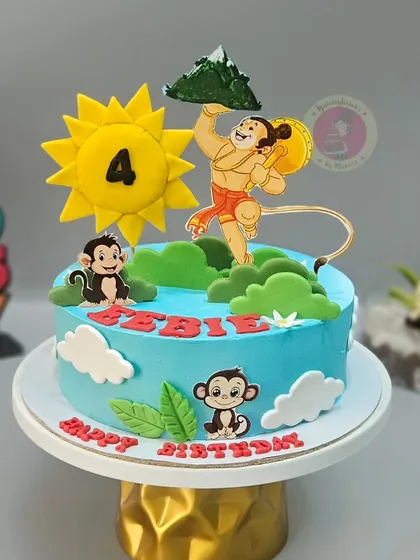 A simple yet heartfelt Hanuman-themed cake, featuring the mighty hero lifting the mountain.