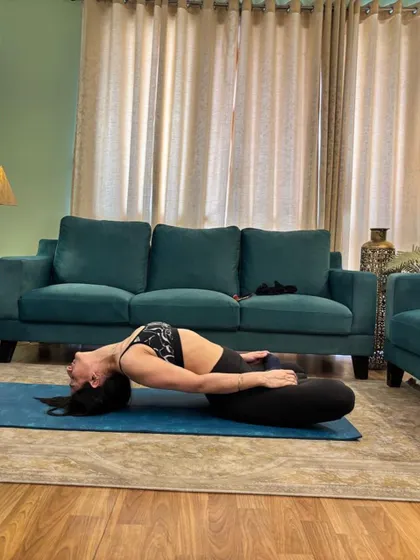 Fish pose from a wider view, the whole room in frame.
