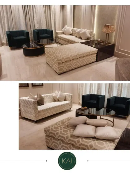This image displays a complete living room arrangement we delivered, including a patterned sofa, a large geometric-print ottoman, and two solid dark green armchairs. The combination of patterns and solids creates a balanced and dynamic space.