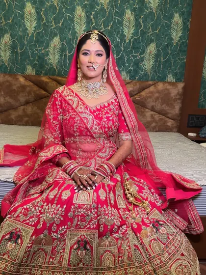 My bride Ankita, seated and ready for her ceremony. Her full lehenga is on display, and her makeup is set to last through the entire day's events.