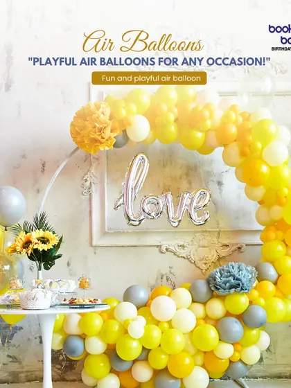 This sunny yellow and grey balloon circle is a beautiful and modern piece of decor. It features a "love" foil balloon in the center, making it a lovely backdrop for a bridal shower, engagement party, or anniversary.