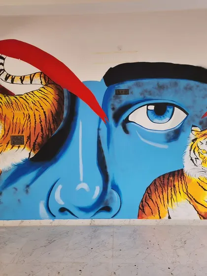 The full view of our tiger mural at Nueva Cafe, a symmetrical and striking piece that adds a fierce energy to the space.