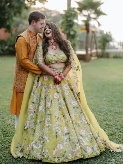 Pure laughter and joy. This photo perfectly captures the fun vibe of a Mehndi ceremony.