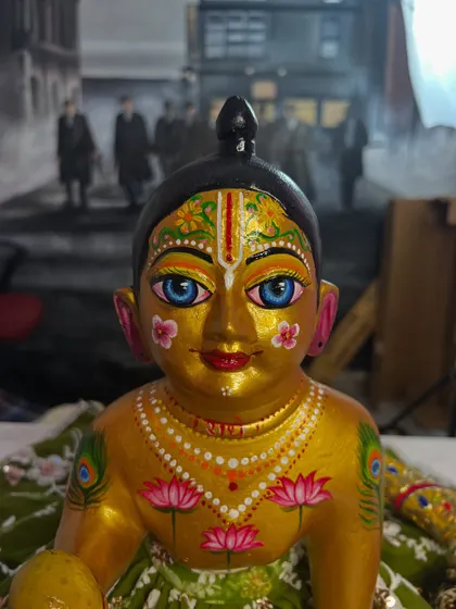 A close-up of the 'after' result. I repainted the face with delicate details like lotus flowers and peacock feathers to give it a divine look.