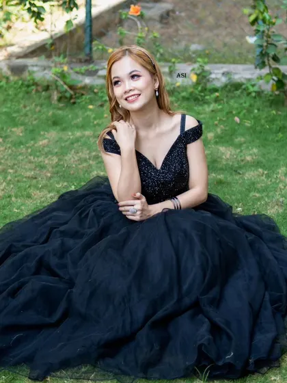 Another lovely shot of the black ballgown, a versatile and elegant option available for rent.