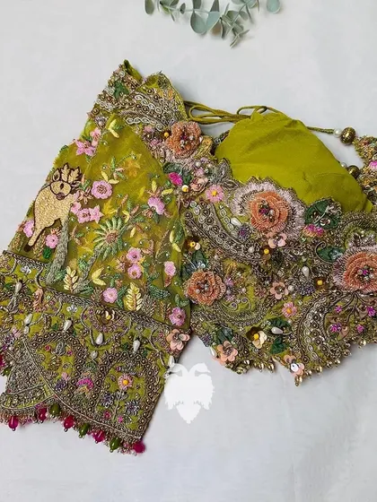 A close-up of the back of the mustard blouse.