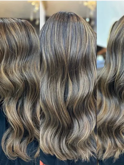 This look combines a global base color with expertly placed balayage highlights, all protected by an Olaplex treatment. The result is a multi-tonal, vibrant style with incredible shine.
