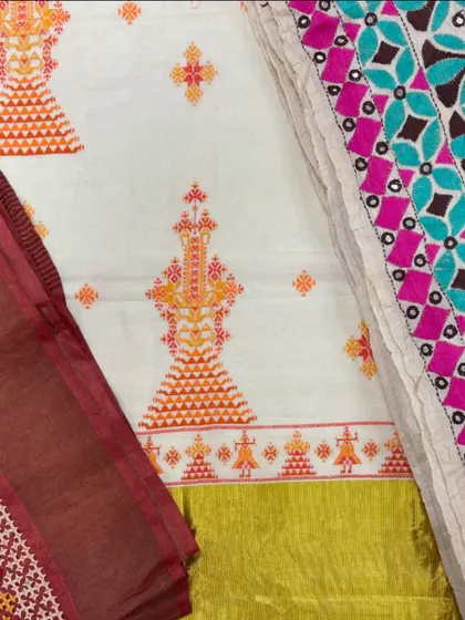 A beautiful display of different embroidered fabrics and pieces at my studio sale. You can see the variety of colors and styles, from Kasuti to patchwork.