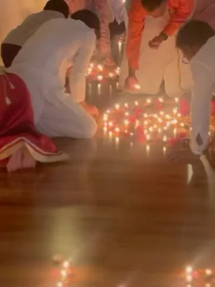 Students bowing in reverence, surrounded by the light of a thousand diyas. Such moments create bonds that are of primordial importance for our inner self, where we can be our true selves without being judged.