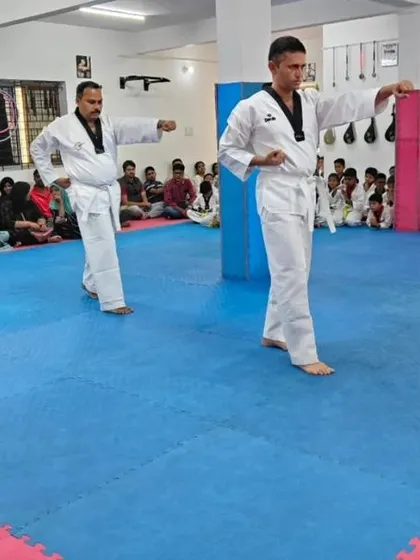Two senior students demonstrating a form.