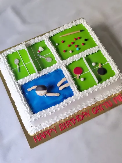 A cake for a boy who loves all sports. This square cake is divided into four sections, representing snooker, badminton, table tennis, and swimming.
