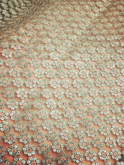 An example of the beautiful fabrics I source for my collection. This is an all-over floral sequin net, which creates a dazzling effect for evening wear.