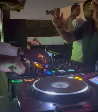 A close-up of my hands on the Pioneer DJ mixer during a sundowner set. This is where the magic happens.