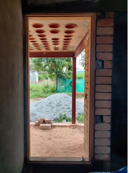 Looking out from inside the structure, the filler slab ceiling frames the view and demonstrates a commitment to sustainable building from the ground up.