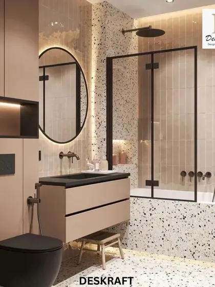 This shot provides another angle of the vanity and toilet, highlighting the cohesive design and the effective use of a neutral palette with bold black accents.