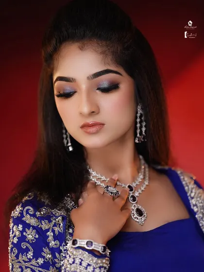 The shimmer on the eyelids catches the light beautifully, a technique we practice for creating stunning photo-ready makeup.
